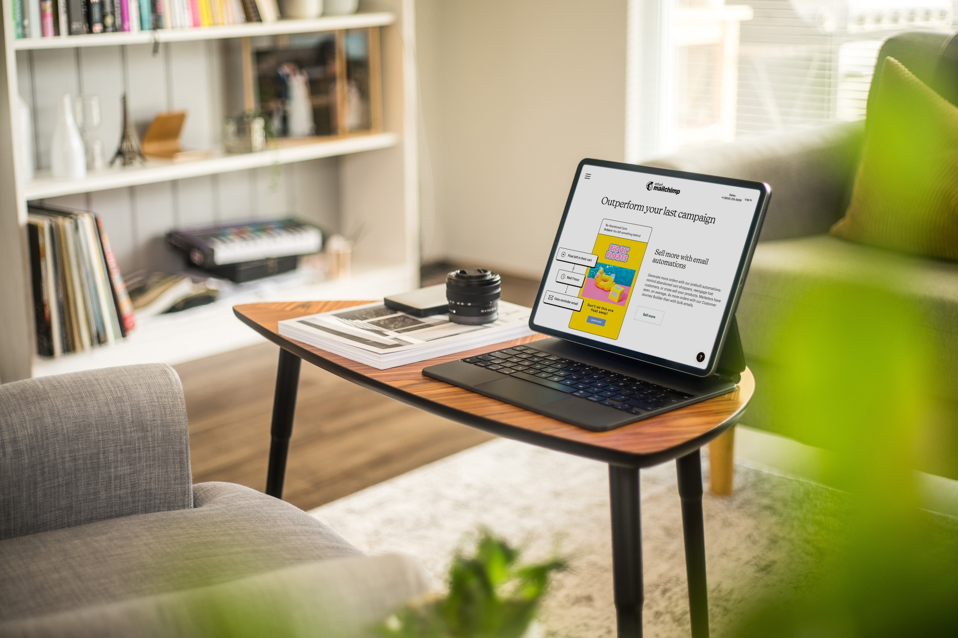 A tablet sitting on a desk showing Mailchimp email creation software