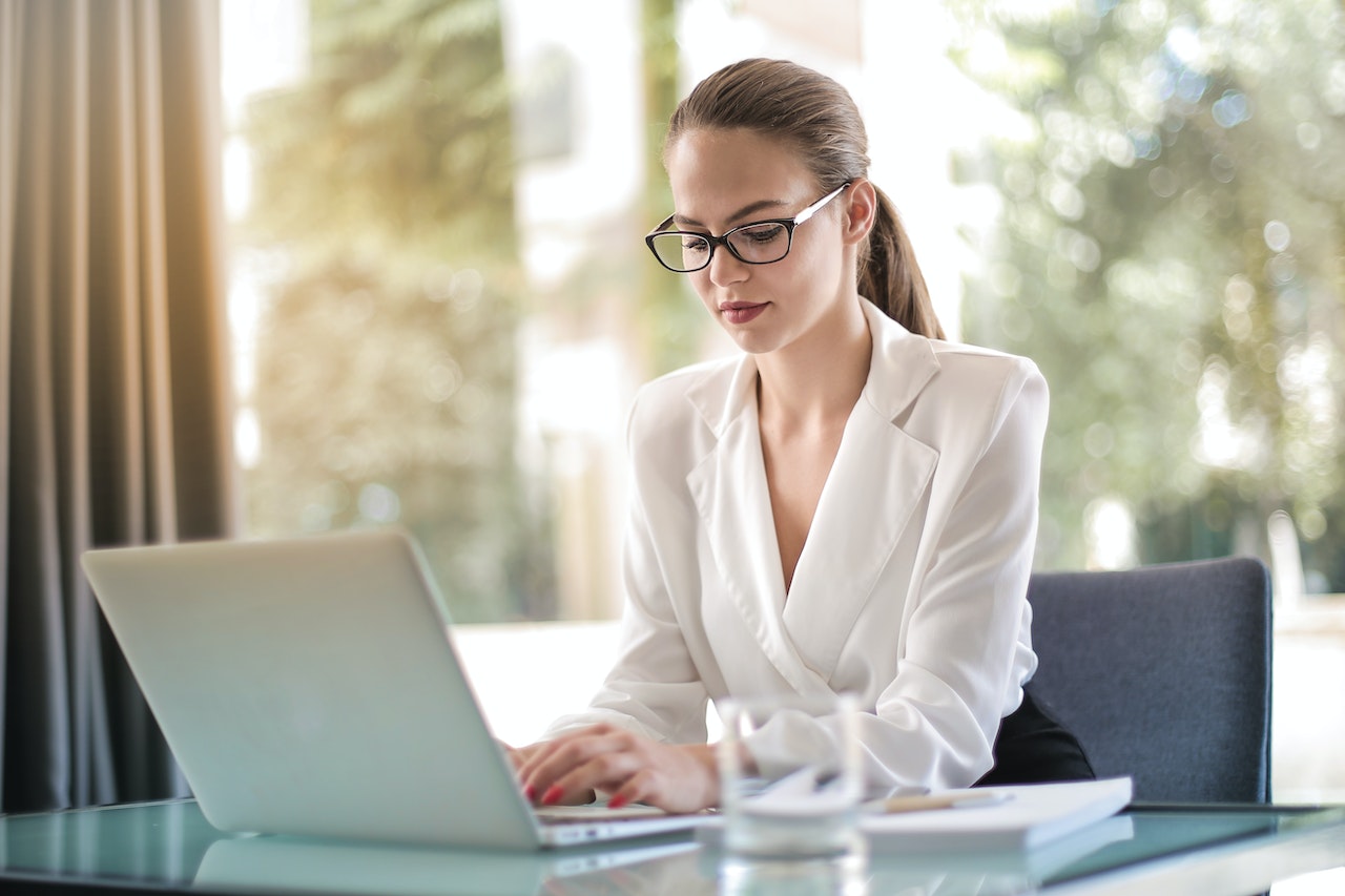 Corporate professional working in office on computer