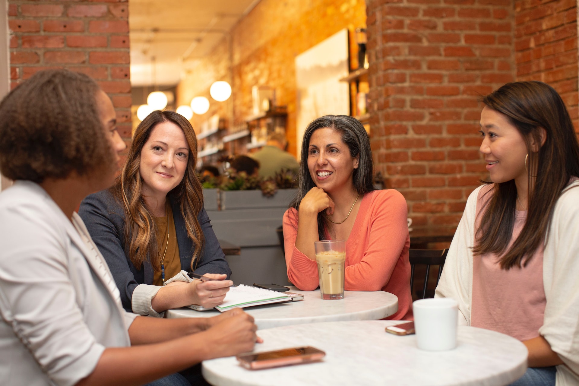 Employees communicating during meeting