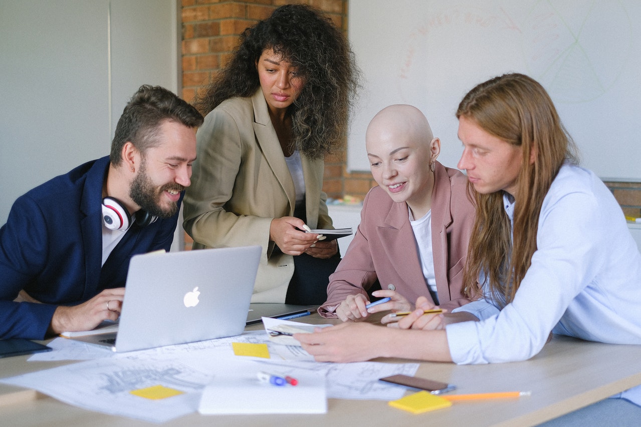 Group of people working with laptop