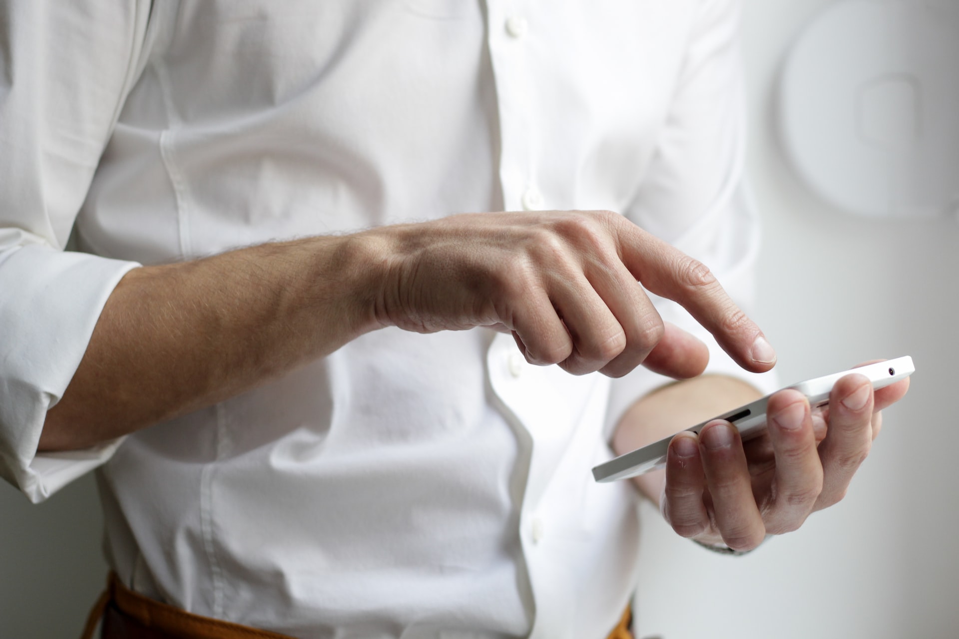 Professional using phone to read emails