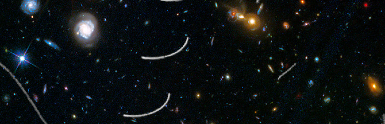 HubbleSite: News - Hubble Sees Nearby Asteroids Photobombing Distant Galaxies