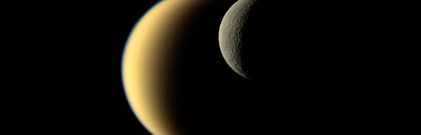 Saturn`s Contrasting Moons Pair Up in Spectacular Cassini Photo