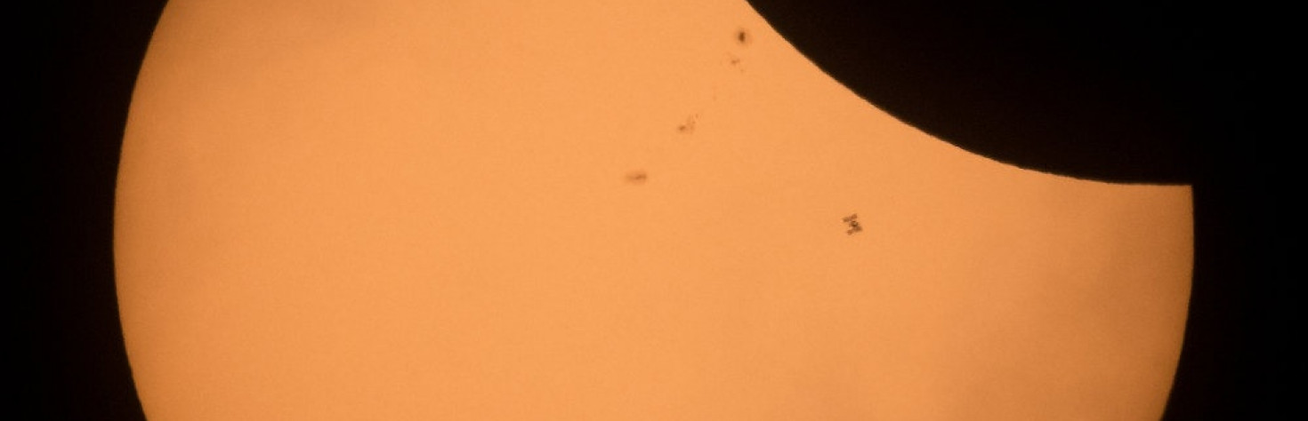 Watch the International Space Station Cross Over the Eclipsed Sun
