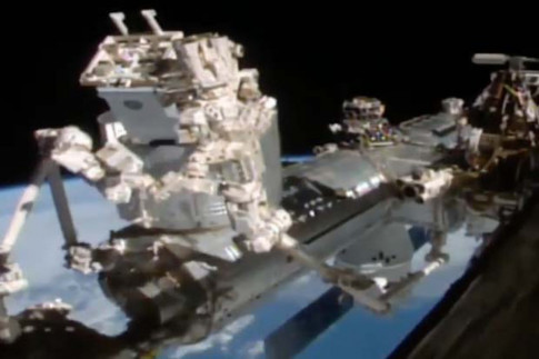 Space Station Robot Installs Neutron Star Explorer: Watch the...