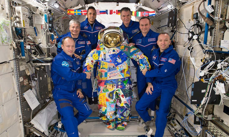 Astronauts Take on Science, Plumbing and Cargo Duties Today