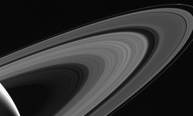 Saturn Moon Tethys Shines Above Rings in Gorgeous Photo