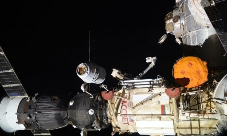 Science-Laden Dragon Arrives at Space Station after Flawless...