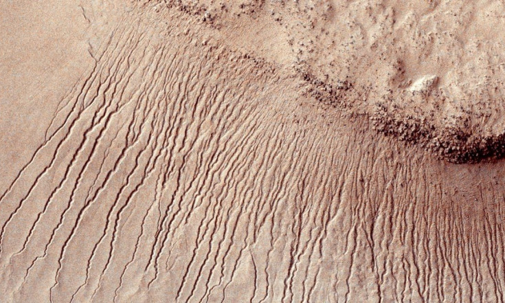 What could explain the mystery of how land formed on Mars without much water